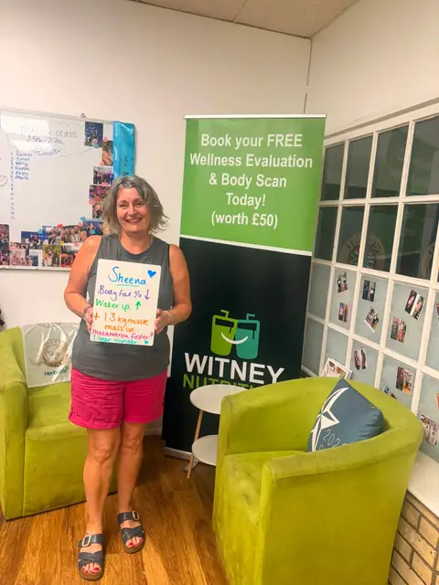 A club member holds up her assessment board at the club in Witney