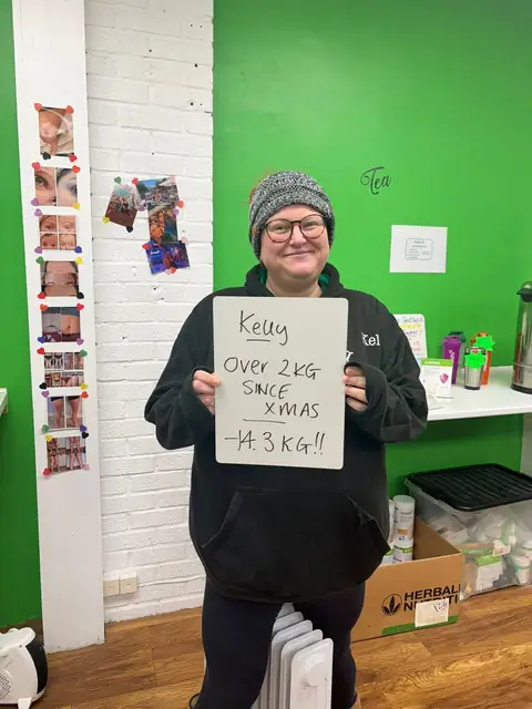 A club member holds up her assessment board at the club in Witney